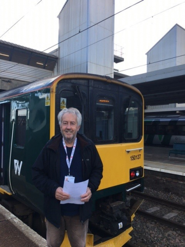 Cllr Hopkins in front of train 